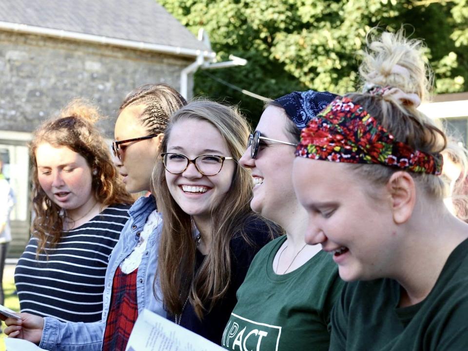 A group of participants celebrate the completion of the Impact Ireland short term outreach.