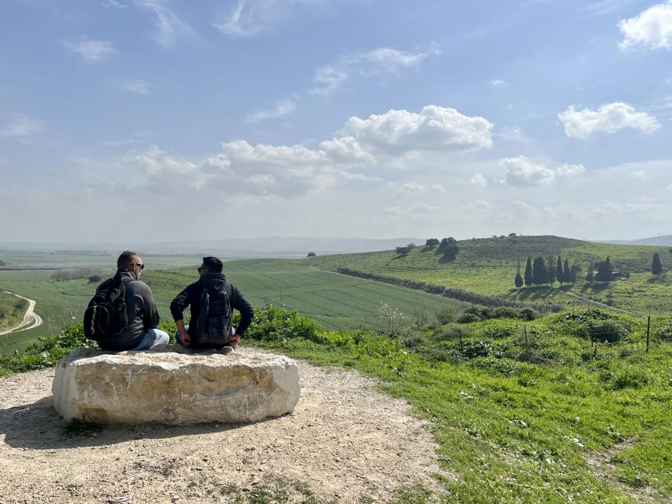 Two men talk in the Jezreel Valley. Photo by Kate Toretti.