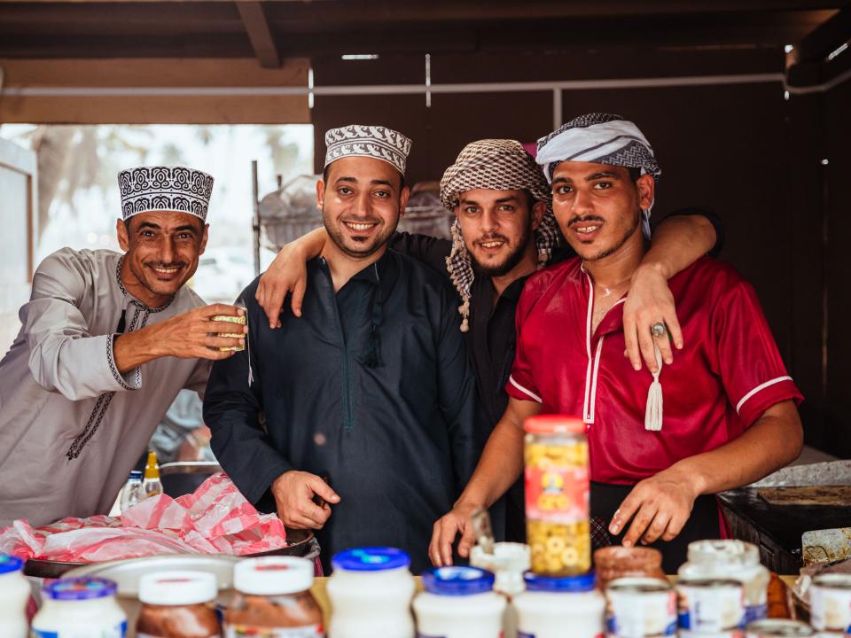 Salalah, Oman :: Local men smile for a photo.
