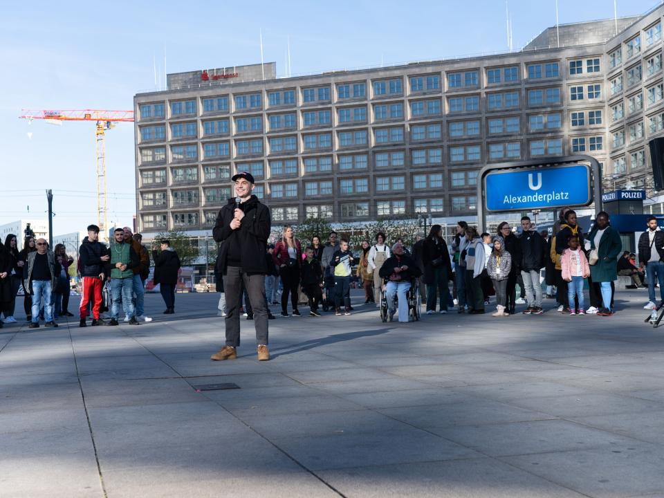 A young man is sharing his testimony during an Easter Outreach in Berlin. Photo by Achim Schneider.