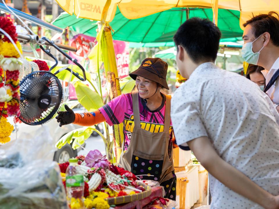 Bangkok, Thailand :: A Thai woman selling flowers.