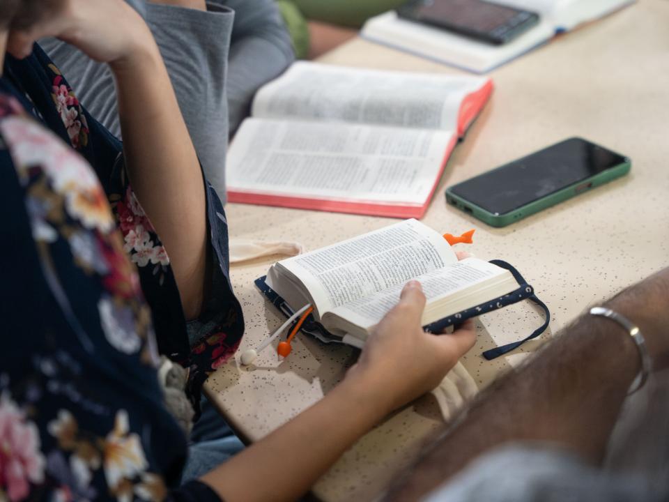 A group of young people study the Bible together. Photo by RJ Rempel.