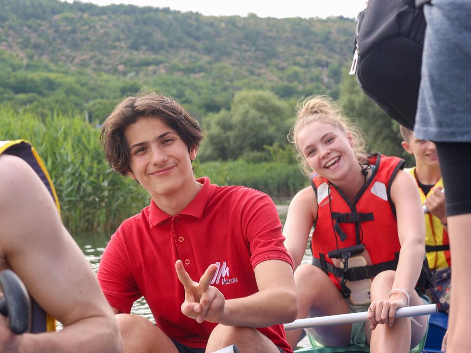 Team members pose for a picture on the River Adventure raft. Photo by Jordan Wilkinson.