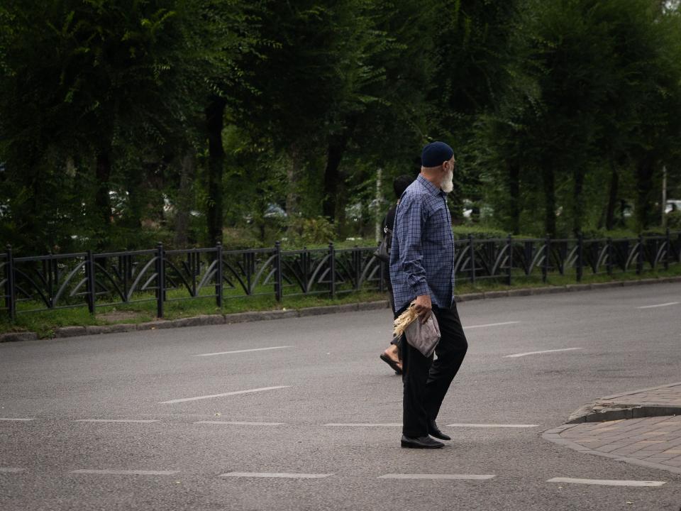 A man walks to the mosque for Jum'ah. Photo by RJ Rempel.