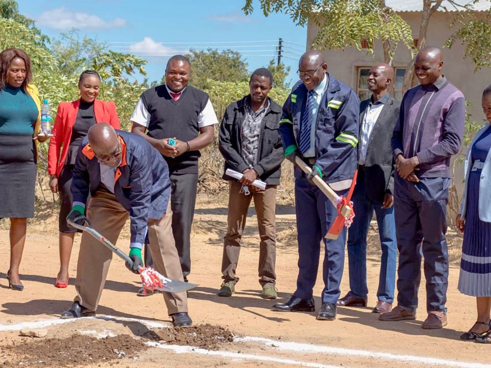 Breaking ground for a protective wall at Makwati School in Zambia, built and run by OM in Zambia. The wall will protect the school from theft and vandalism, while also allowing the school to keep small livestock.