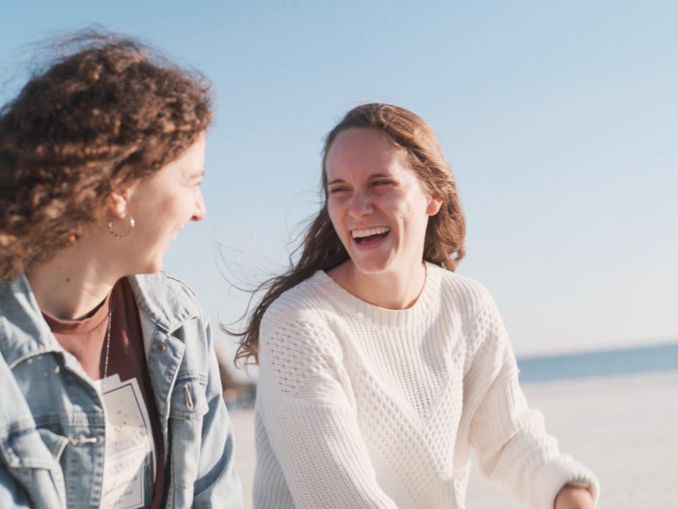 Ships :: Katie enjoys a laugh with another crewmember of OM's Ship Ministry during time in the city