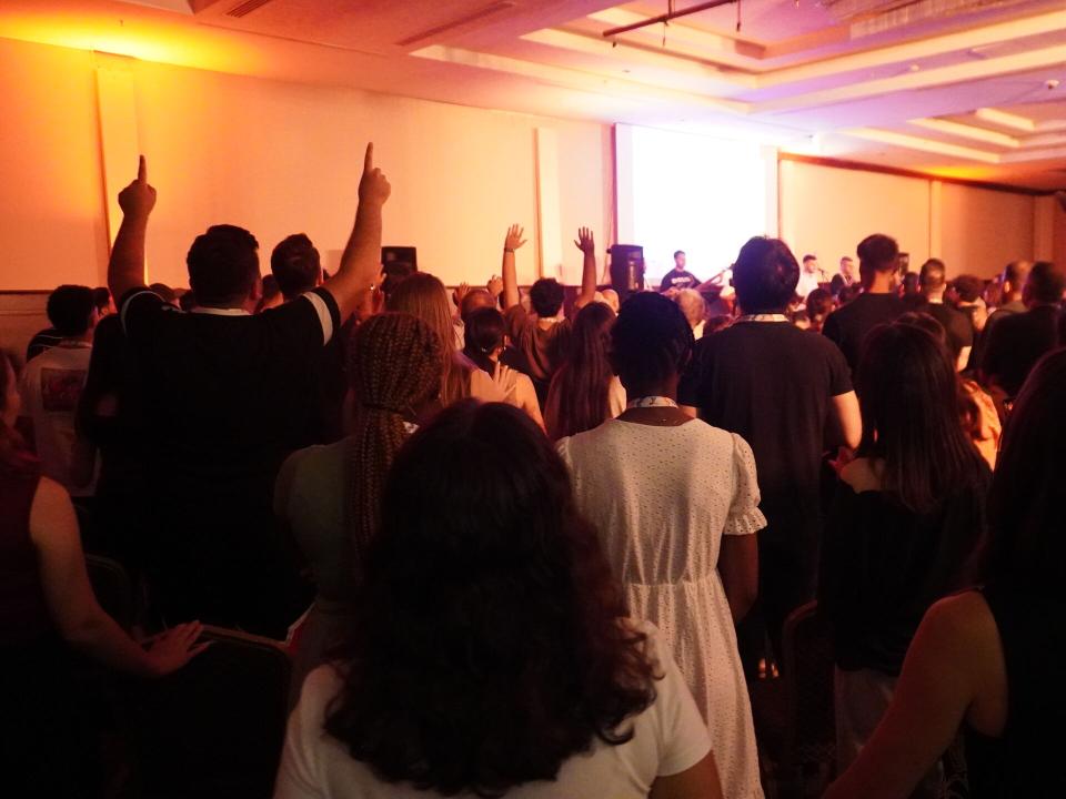 Young adults worship together in Turkiye.
