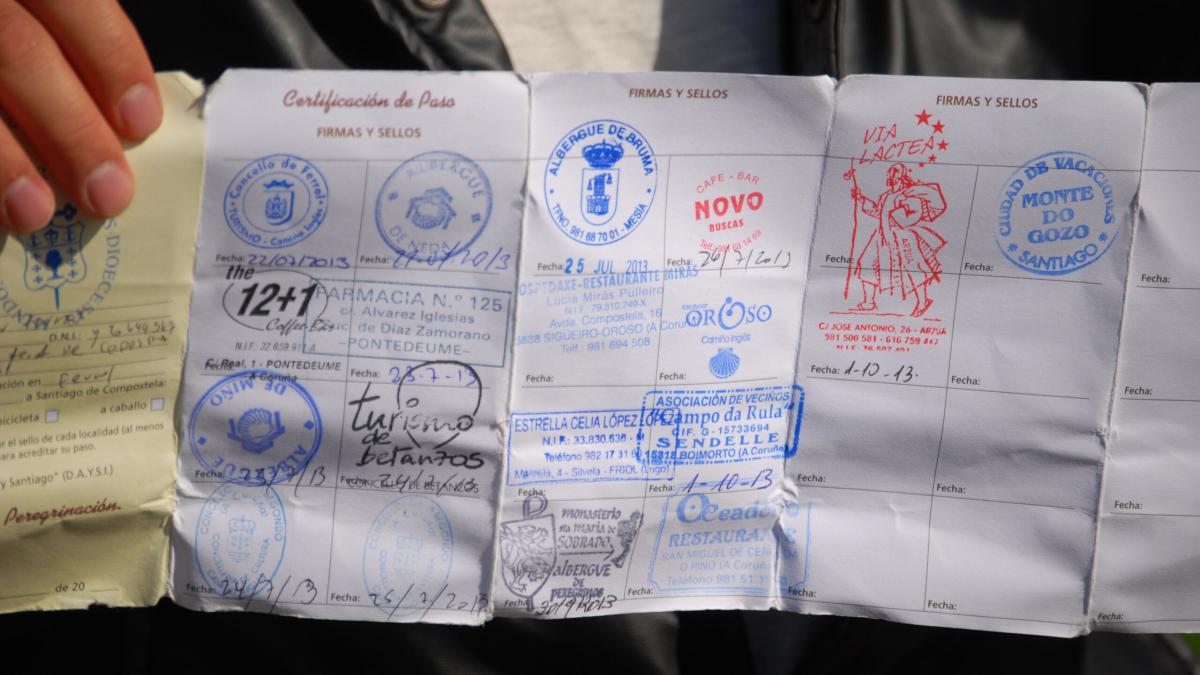 Stamps in your passport show your progress on the Camino de Santiago as you share the Good News with pilgrims.  
Photo by Julia