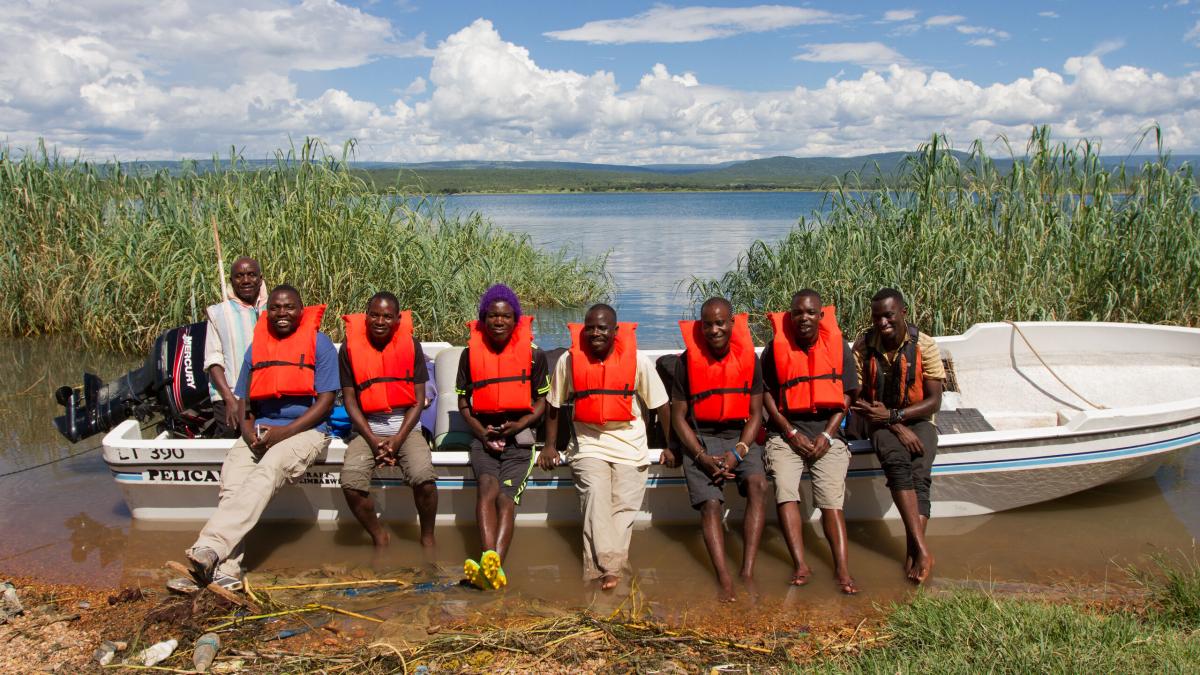 A team travels by boat to an island along Lake Tanganyika for outreach.