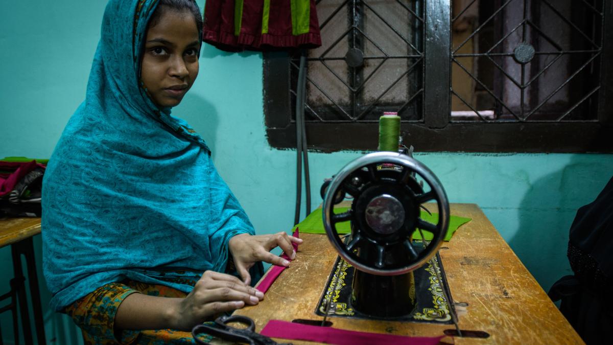Young women living in a slum in Bangladesh have the opportunity to learn a technical skill like sewing, enabling them to earn a living. Photo by Garrett N