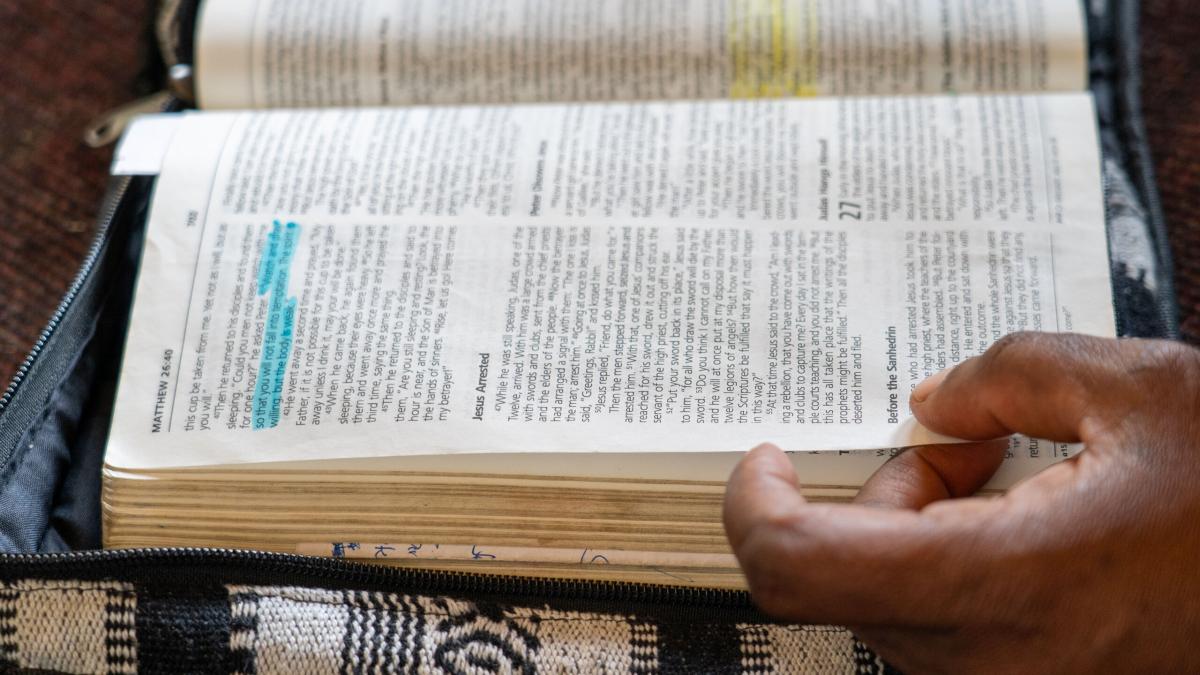 People page through the Bible. Photo by RJ Rempel.
