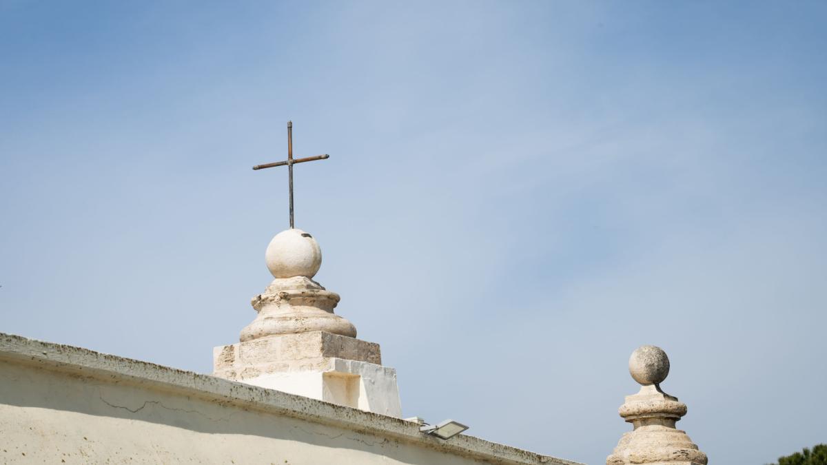 A cross on top of a church. Photo by Rebecca Rempel.