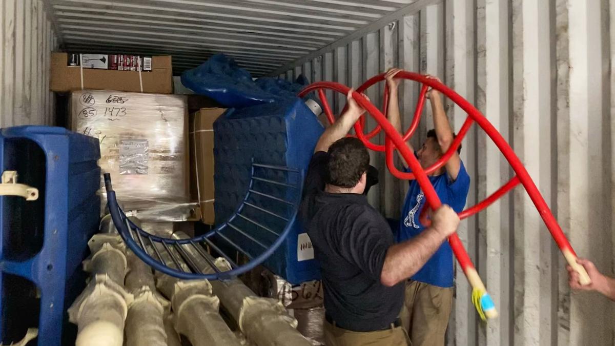 South Carolina, USA :: OM Ships staff load playground equipment into a container of relief supplies for the people of Saint Vincent.