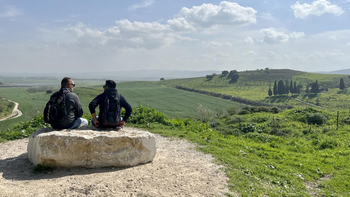 Two men talk in the Jezreel Valley. Photo by Kate Toretti.