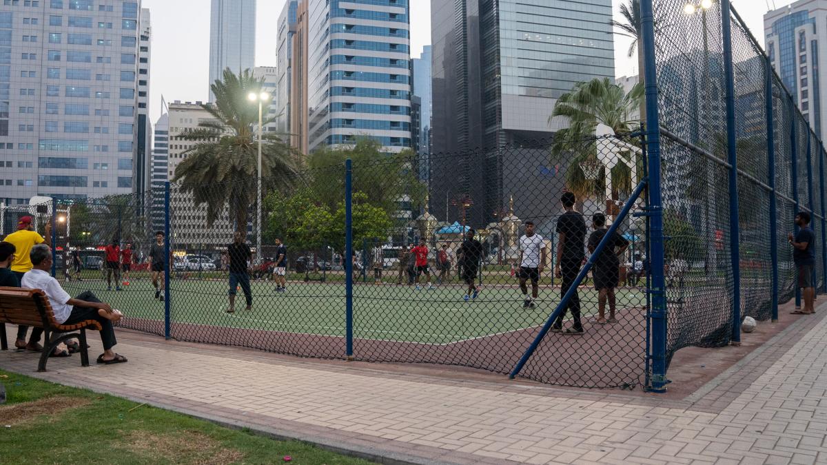 People play football at a park in Abu Dhabi, United Arab Emirates. Photo by RJ Rempel.