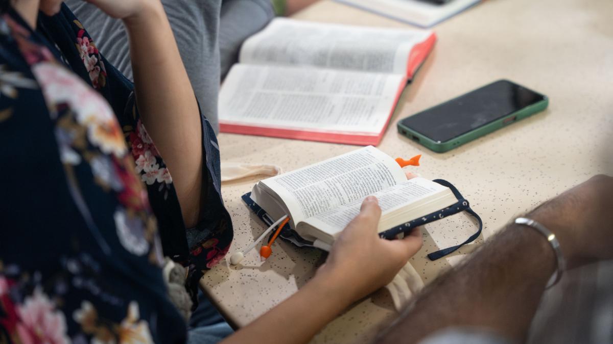 A group of young people study the Bible together. Photo by RJ Rempel.