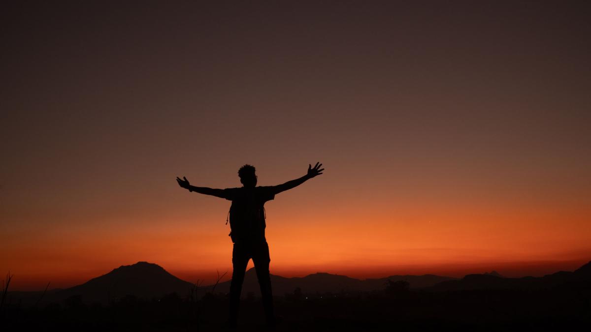 A silhouetted figure at sunset in Malawi. Photo by Ellyn Schellenberg.