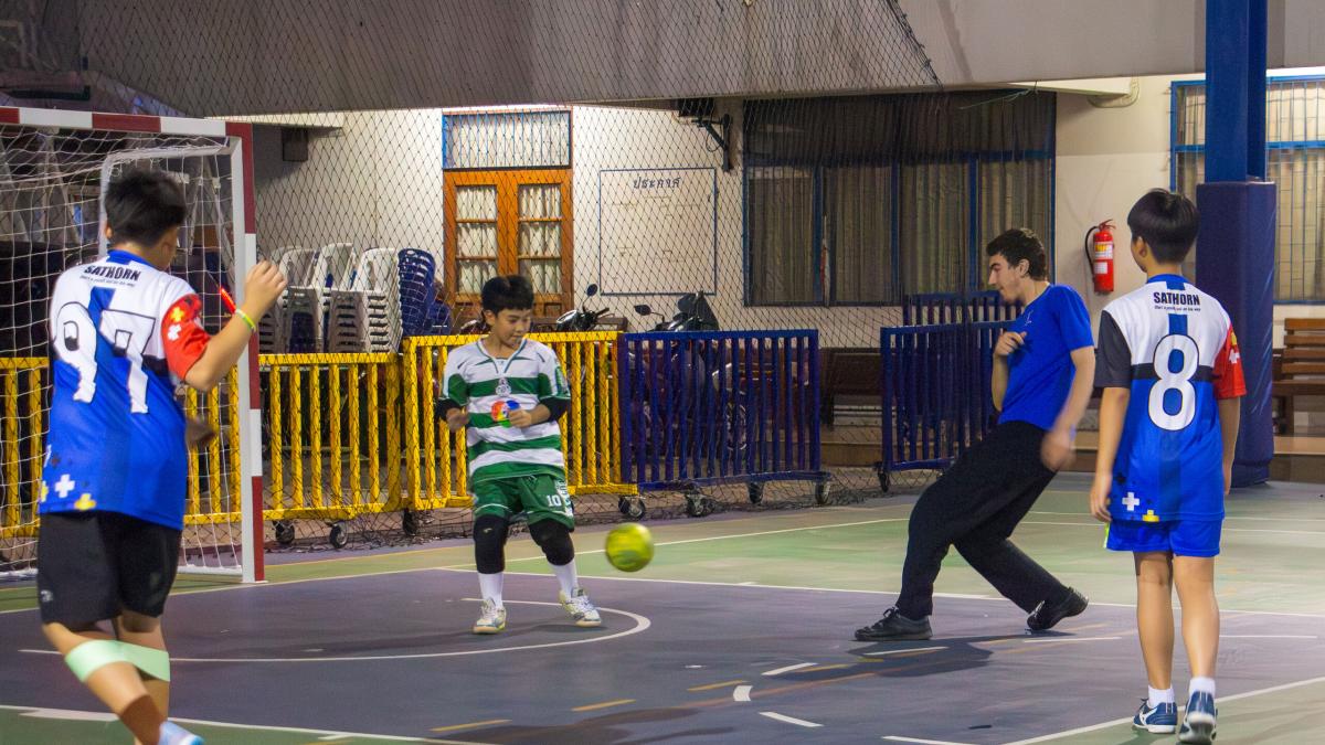 Bangkok, Thailand :: Gian (Ireland) plays football with students from a local school.