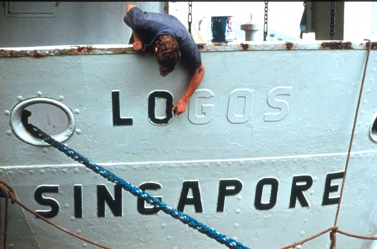 Repainting the name LOGOS on the stern of the ship. - Cebu, Philippines - 20 Jun 1975 - Martin Keiller